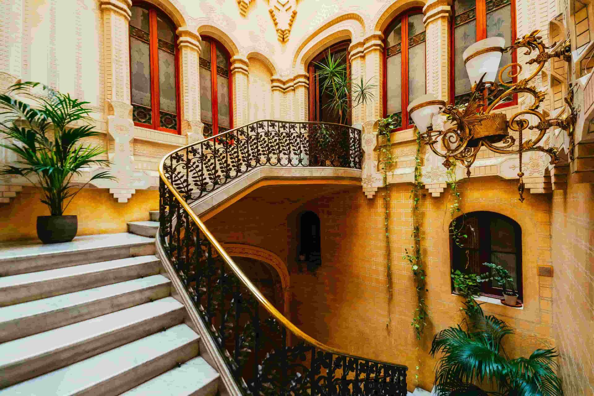 Elegant Spanish modernist building interior with ornate staircase